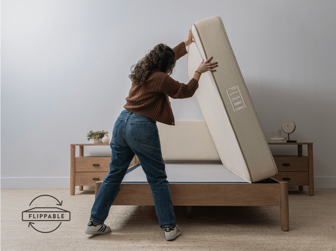 Young woman flipping Plank Firm Natural