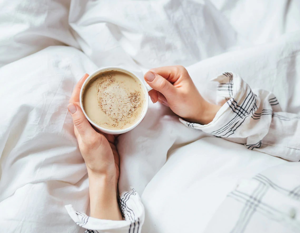 cup of coffee in bed