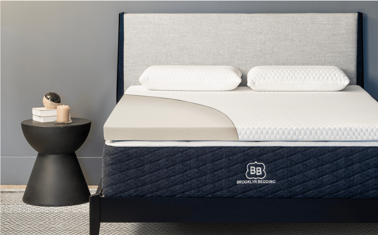 4-lb. Memory Foam Topper on a Brooklyn Bedding Mattress. Grey backboard and simple bed frame.