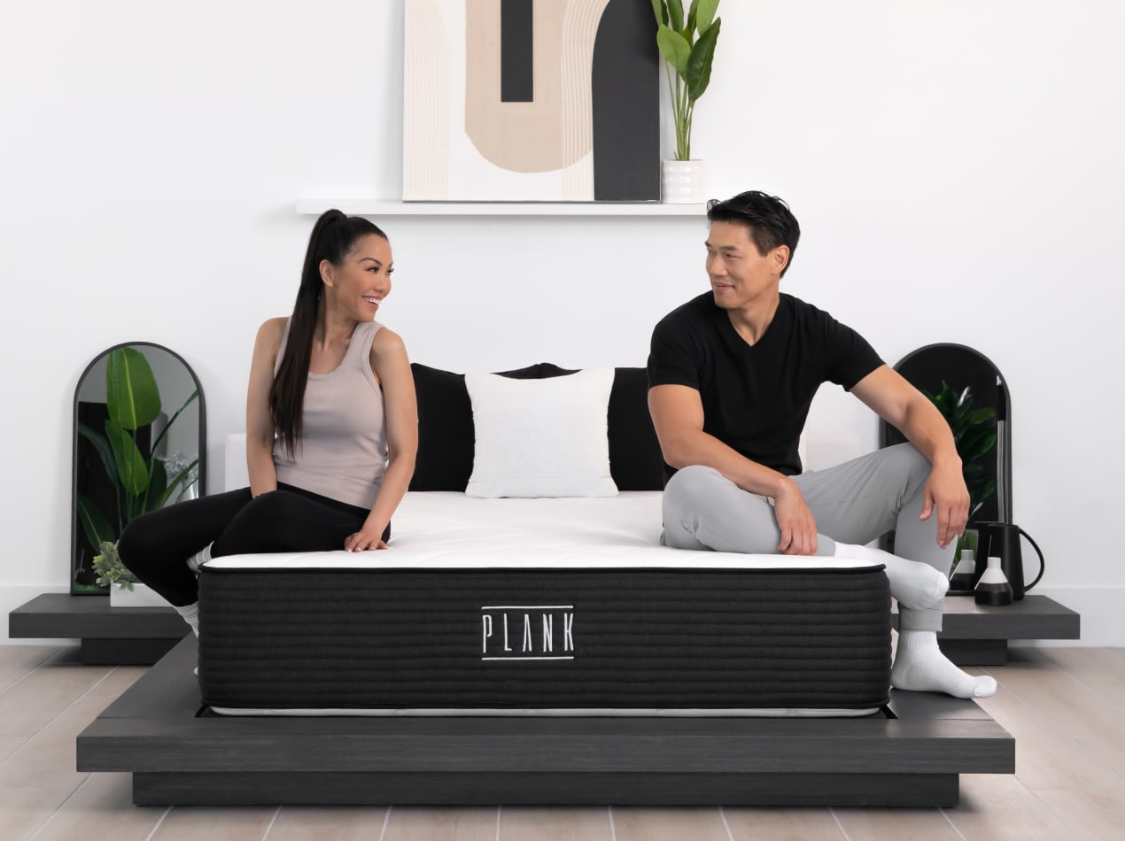 Couple sitting on Plank Firm Luxe