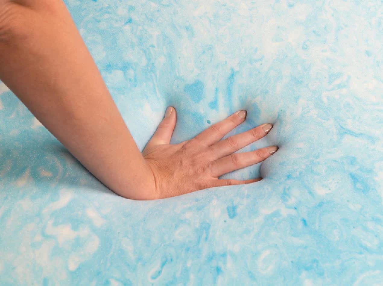 2.5 lb gel swirl memory foam topper with hand pressing into foam