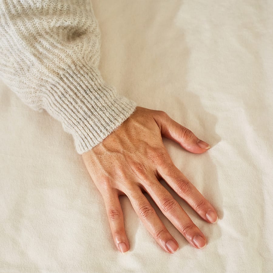 Hand on Birch Mattress Protector