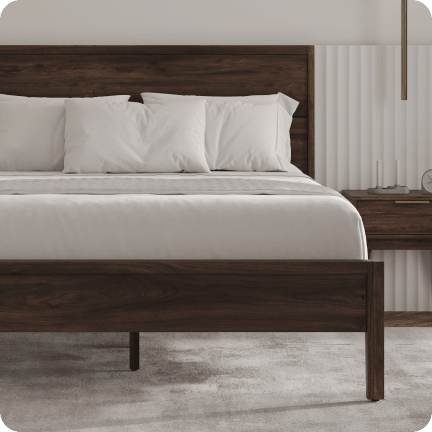 A rendered image of the Ludlow Bed Frame in a bedroom scene