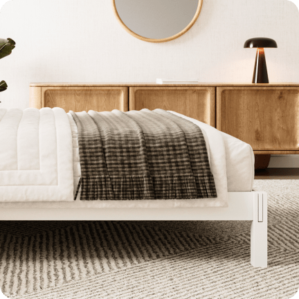 A rendered image of the Madison Bed Frame in a bedroom scene