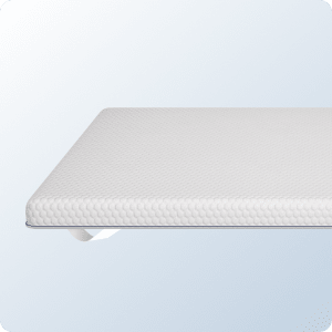 A product image of the Helix Mattress Topper on a blue background gradient