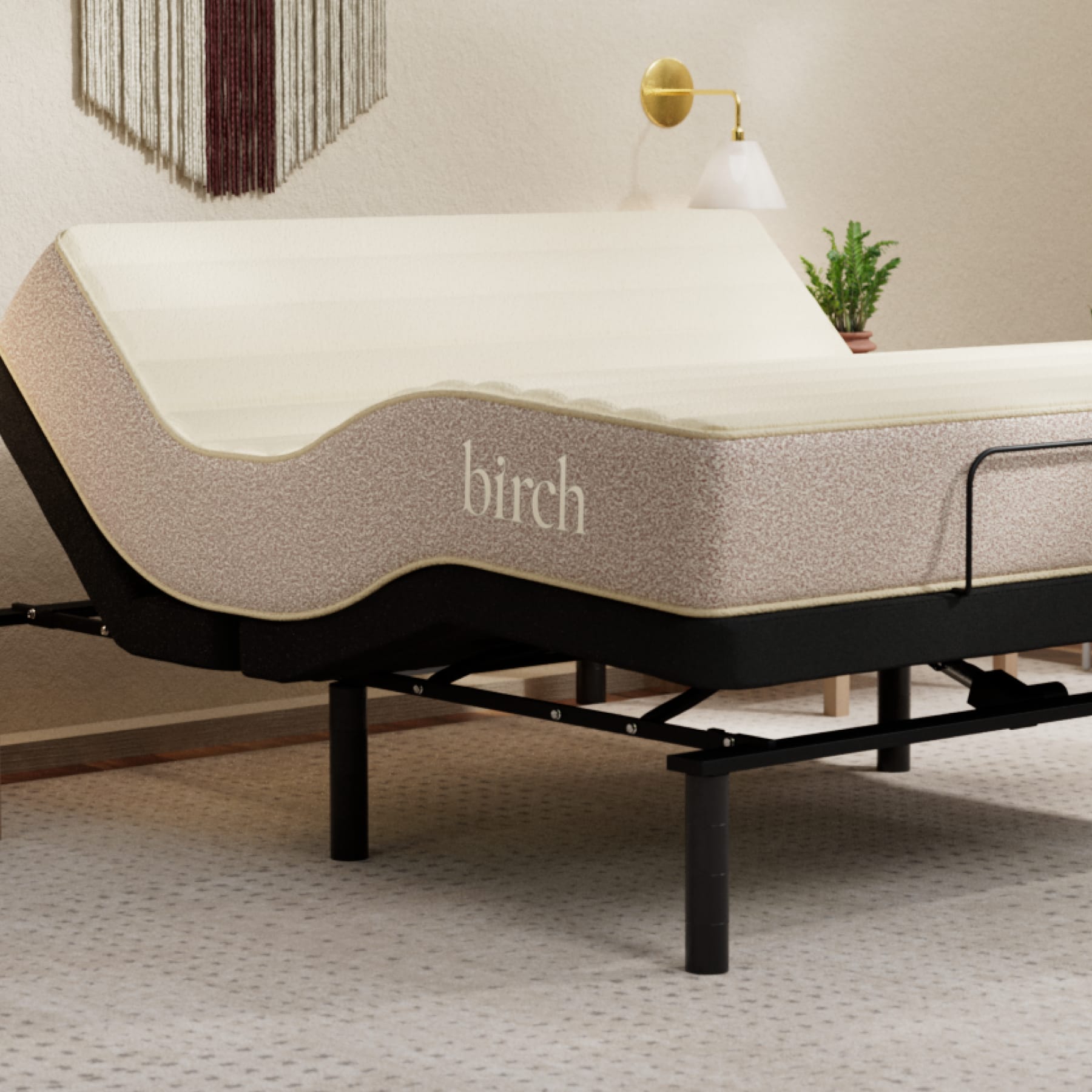 The Adjustable Base in a bedroom scene with a Birch Natural Mattress