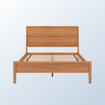 The Ludlow Bed Frame on a light blue background gradient