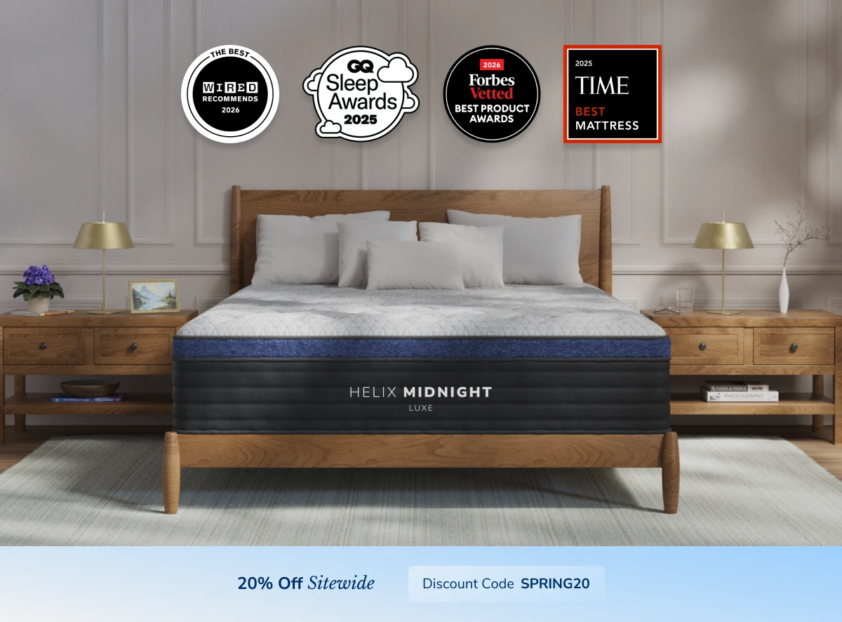 Helix Midnight Luxe mattress on a wood bed frame with side-sleeper award badges