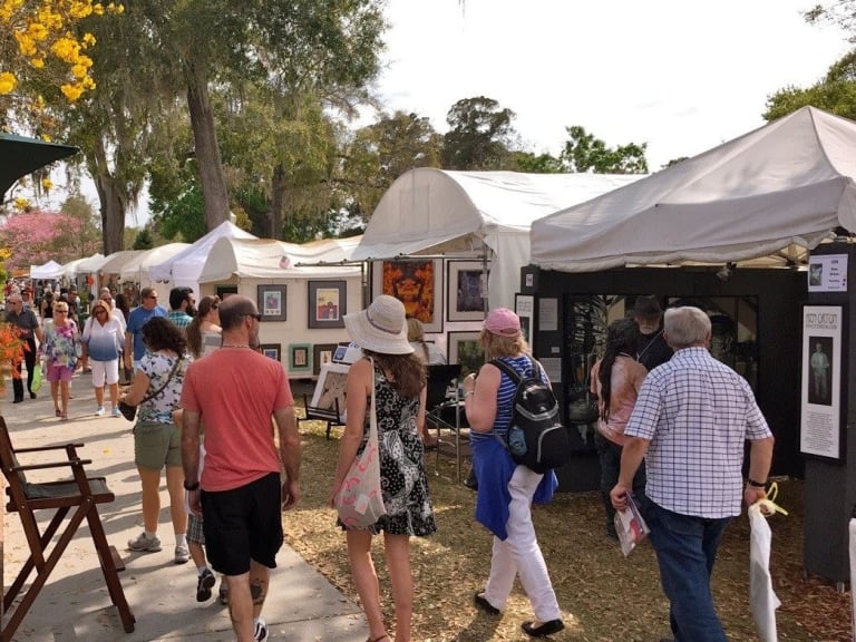 Touring the Washington Square Outdoor Art Exhibit| ©Winter Park Sidewalk Art Festival