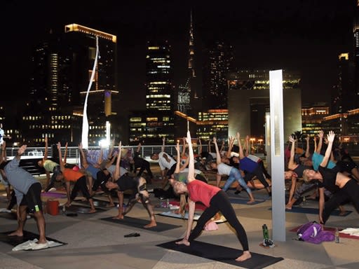 Participating in Dubai Nigh Yoga| ©Wellbeing
