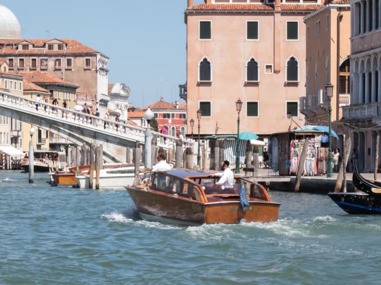 A route No 2 Vaporetto or water bus packed with passengers at the