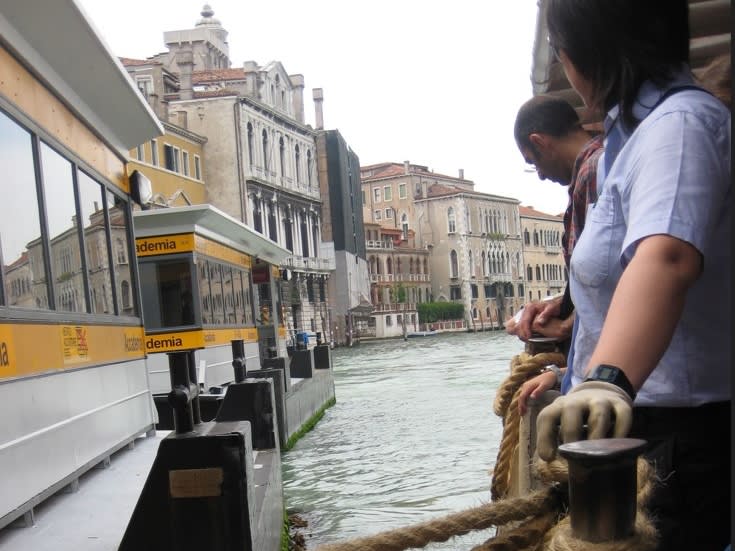 A route No 2 Vaporetto or water bus packed with passengers at the