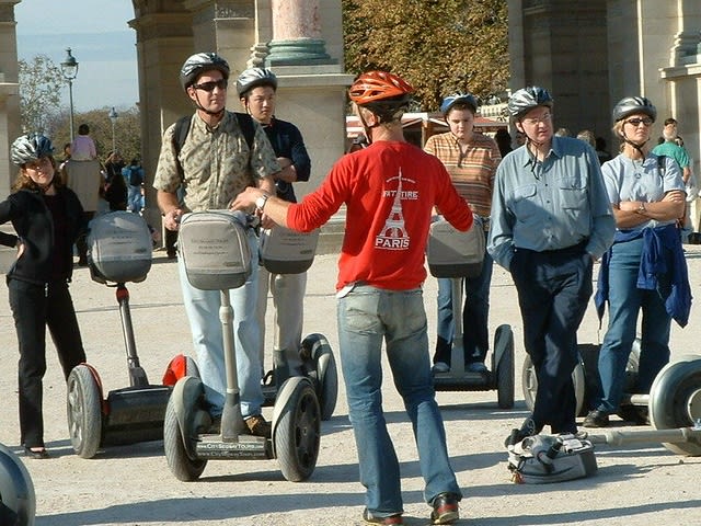 guide with a group of people on segways| ©Happy A