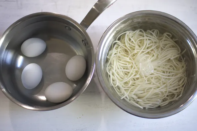 Cook eggs and noodles