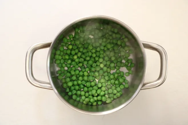 Boil green peas