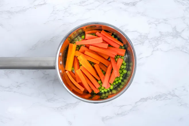 Cook carrots and peas