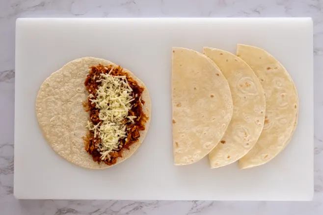 Assemble quesadillas