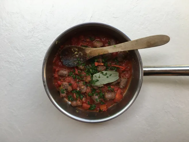 Add herbs and tomoatoes