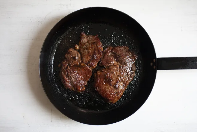 Fry and glaze steaks