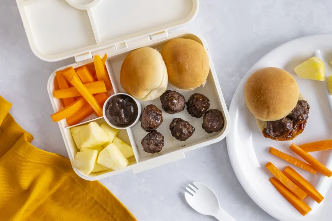 Beef Meatballs with Fresh Pineapple Chunks, Carrot Batons, Barbecue Dipping Sauce and Mini Rolls