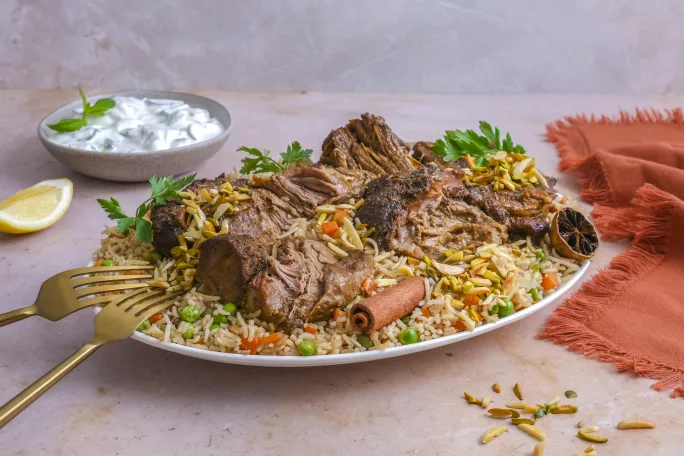 Lamb Shoulder Ouzi with Spiced Rice, Toasted Nuts and Mint Yogurt