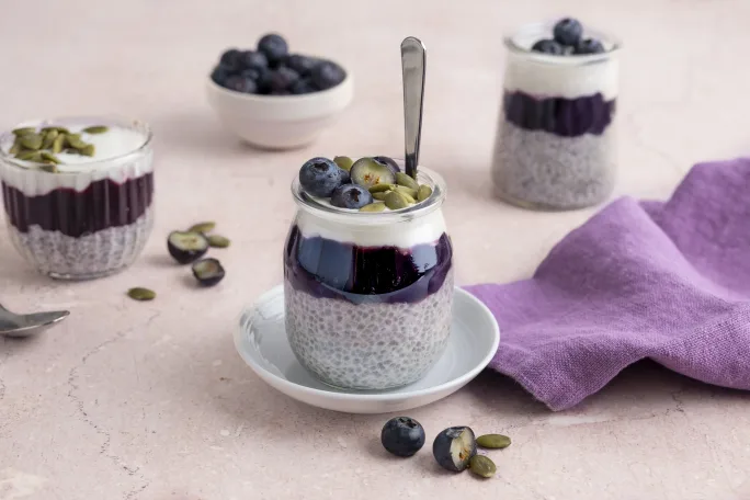Overnight Coconut Chia Pudding with Blueberry Jam, Creamy Yogurt, Fresh Blueberries and Pumpkin Seeds