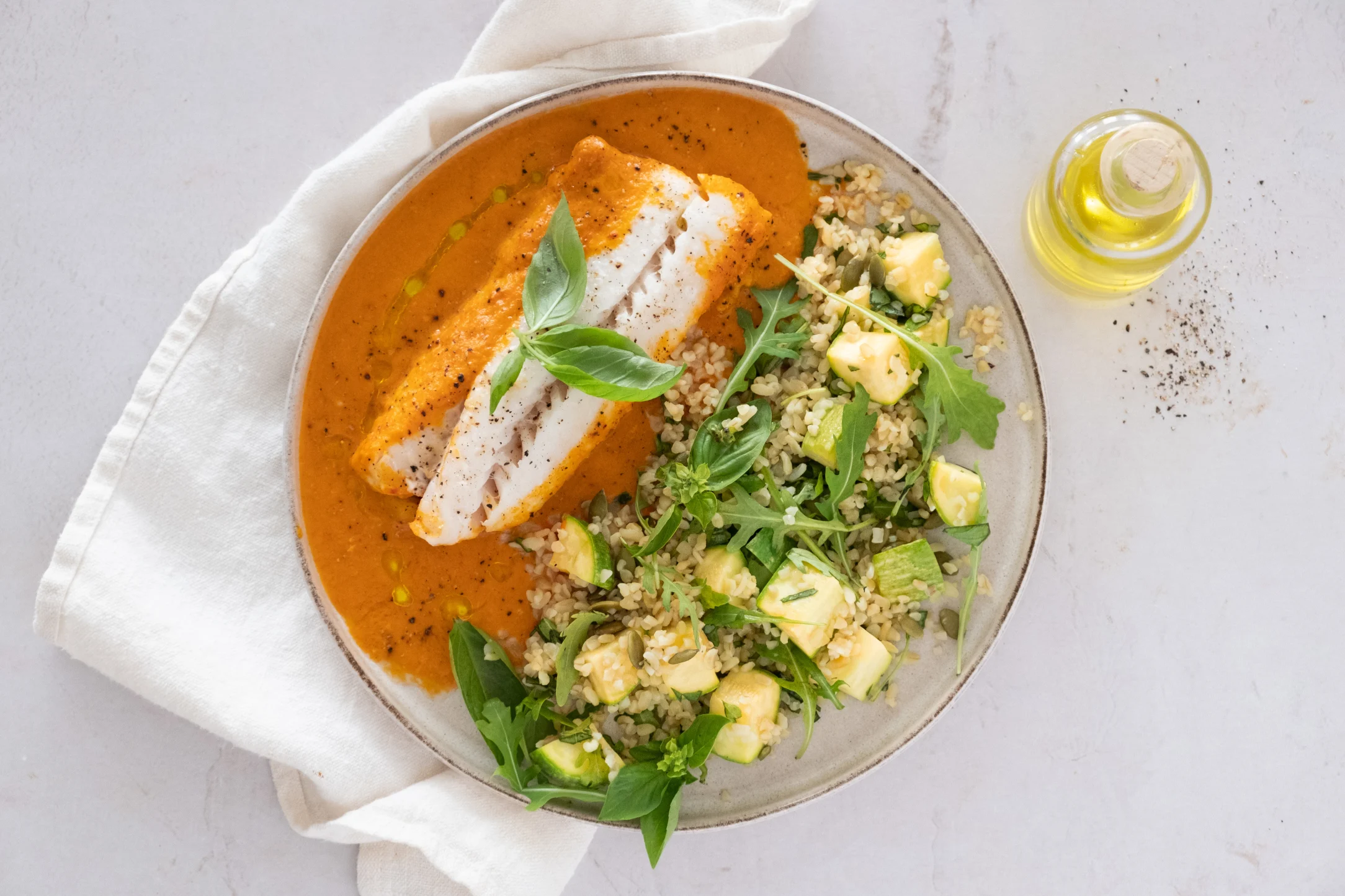 Mediterranean-style Baked Cod in Roasted Red Pepper Sauce with Rocket and Bulgur Salad