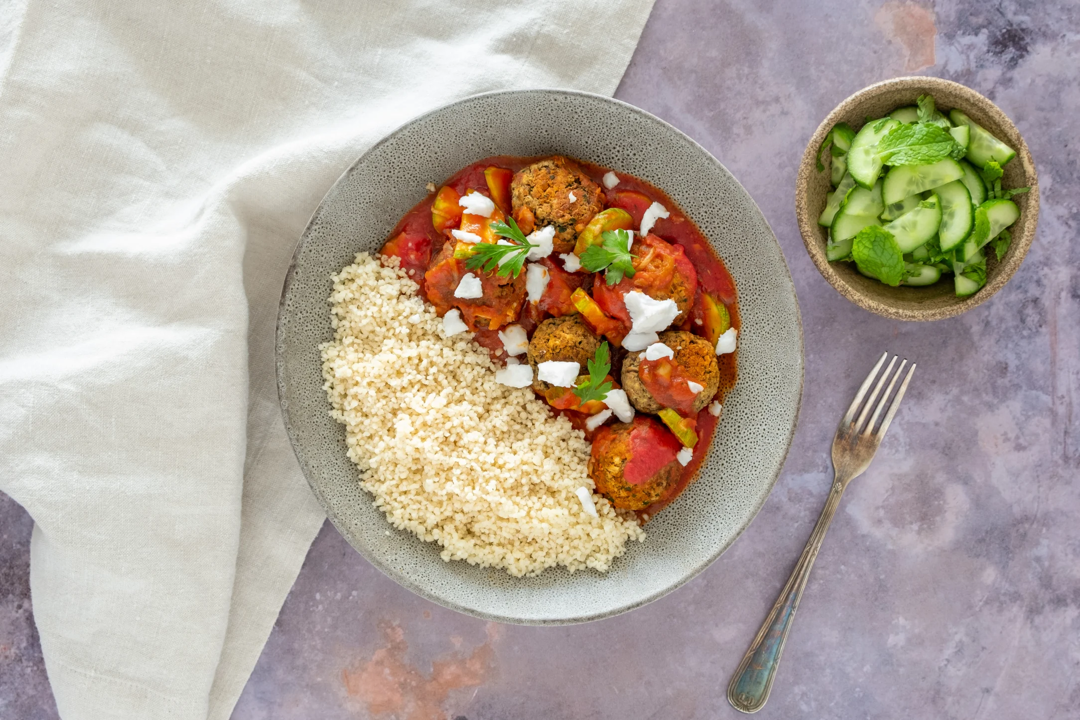 Lentil Meatballs with Harissa Tomato Sauce and Couscous