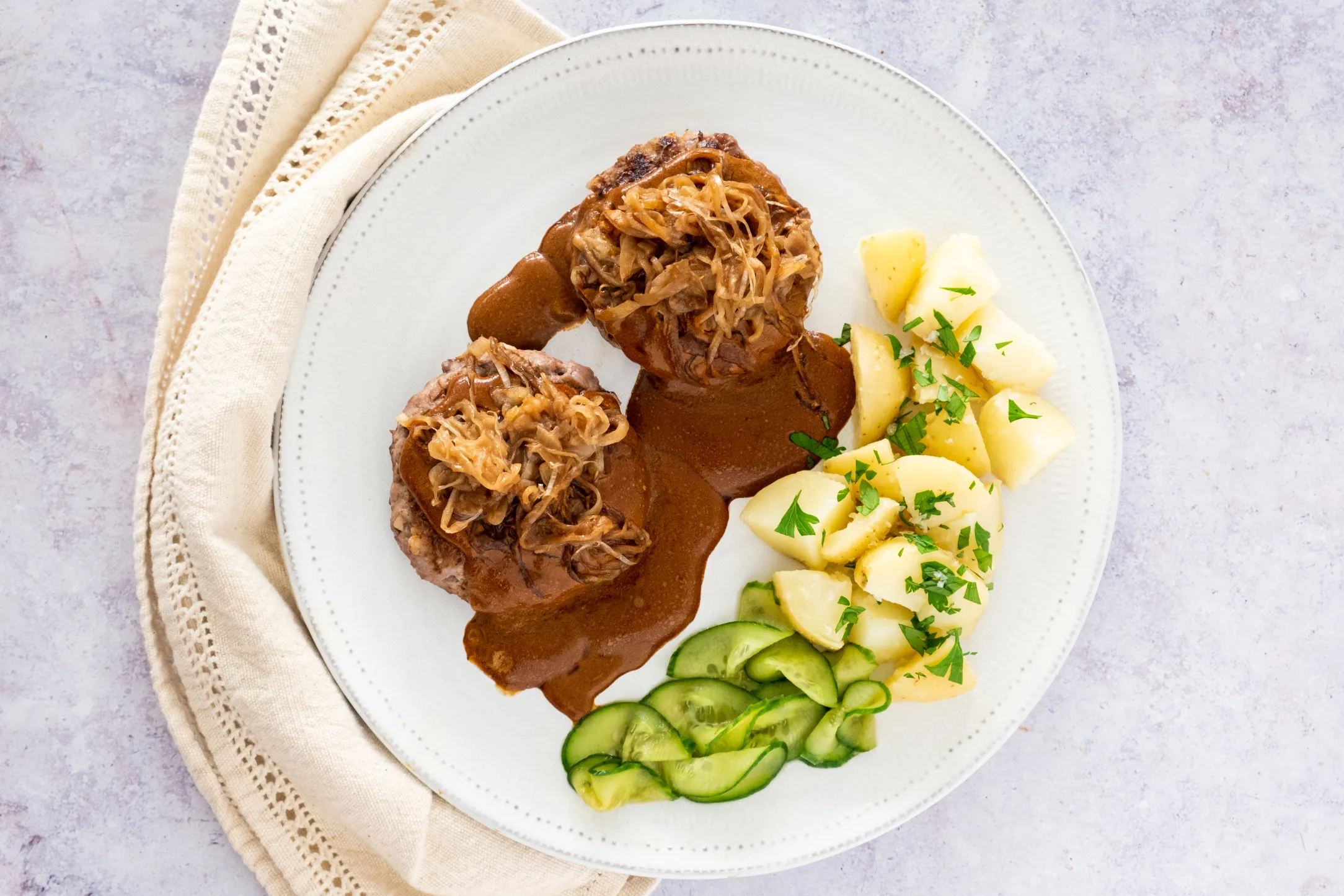 Danish Beef Patties with Caramelised Onions, Buttered Potatoes and Gravy
