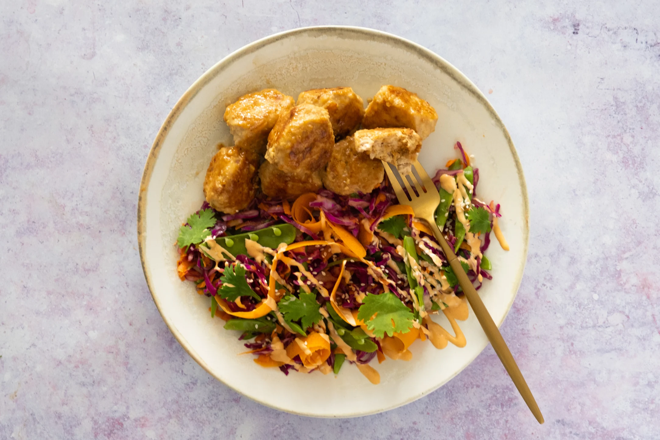 Honey Glazed Chicken Miso Meatballs with Rainbow Slaw