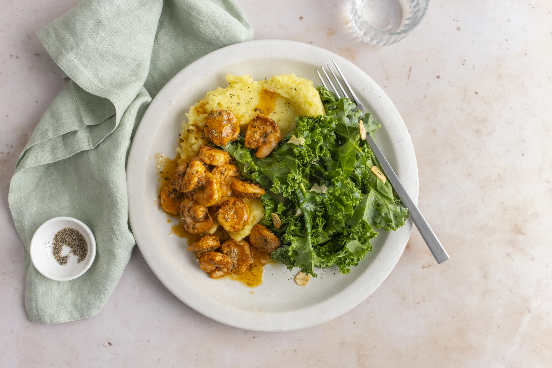 Cajun Prawns with Mashed Potato and Garlic Kale