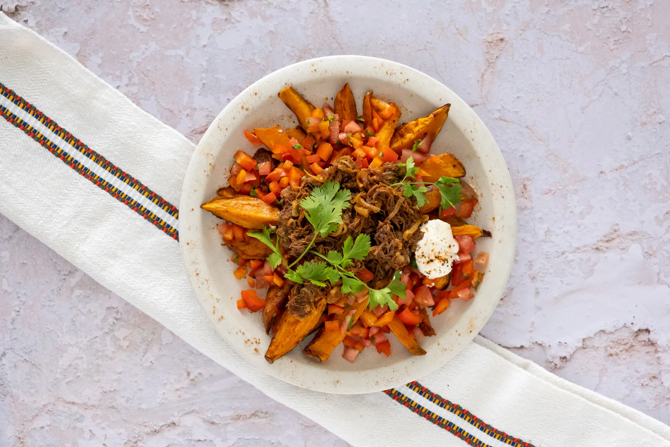 Smoky Mexican Sweet Potato Wedges with Barbecue Pulled Beef and Tomato Salsa