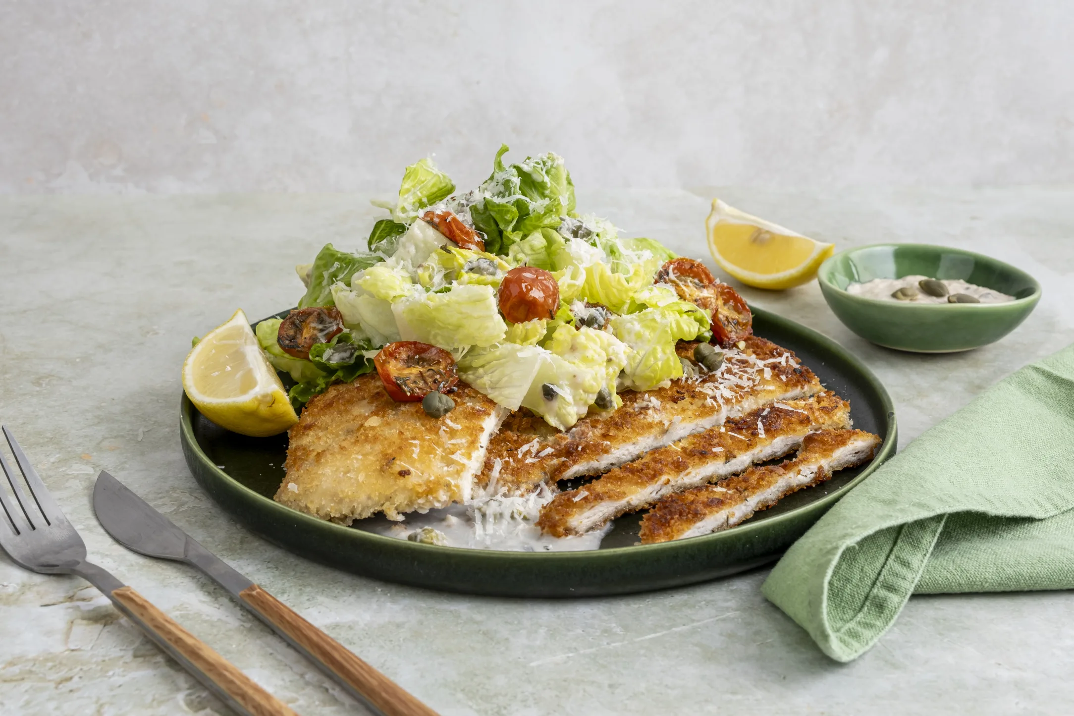Crispy Chicken Schnitzel Caesar Salad with Roasted Cherry Tomatoes