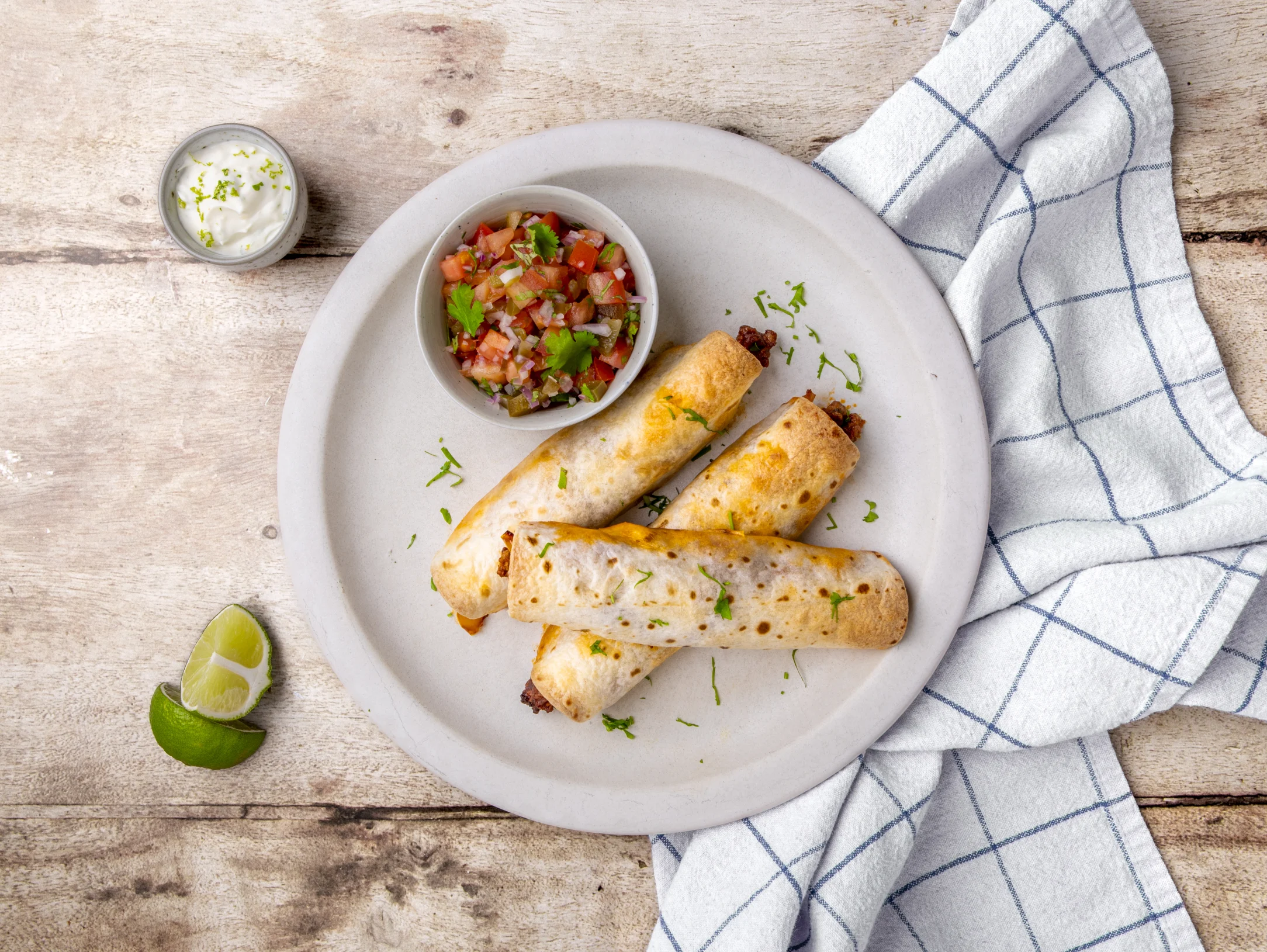 Beef Taquitos with Garlic Lime Crema and Jalapeno Salsa