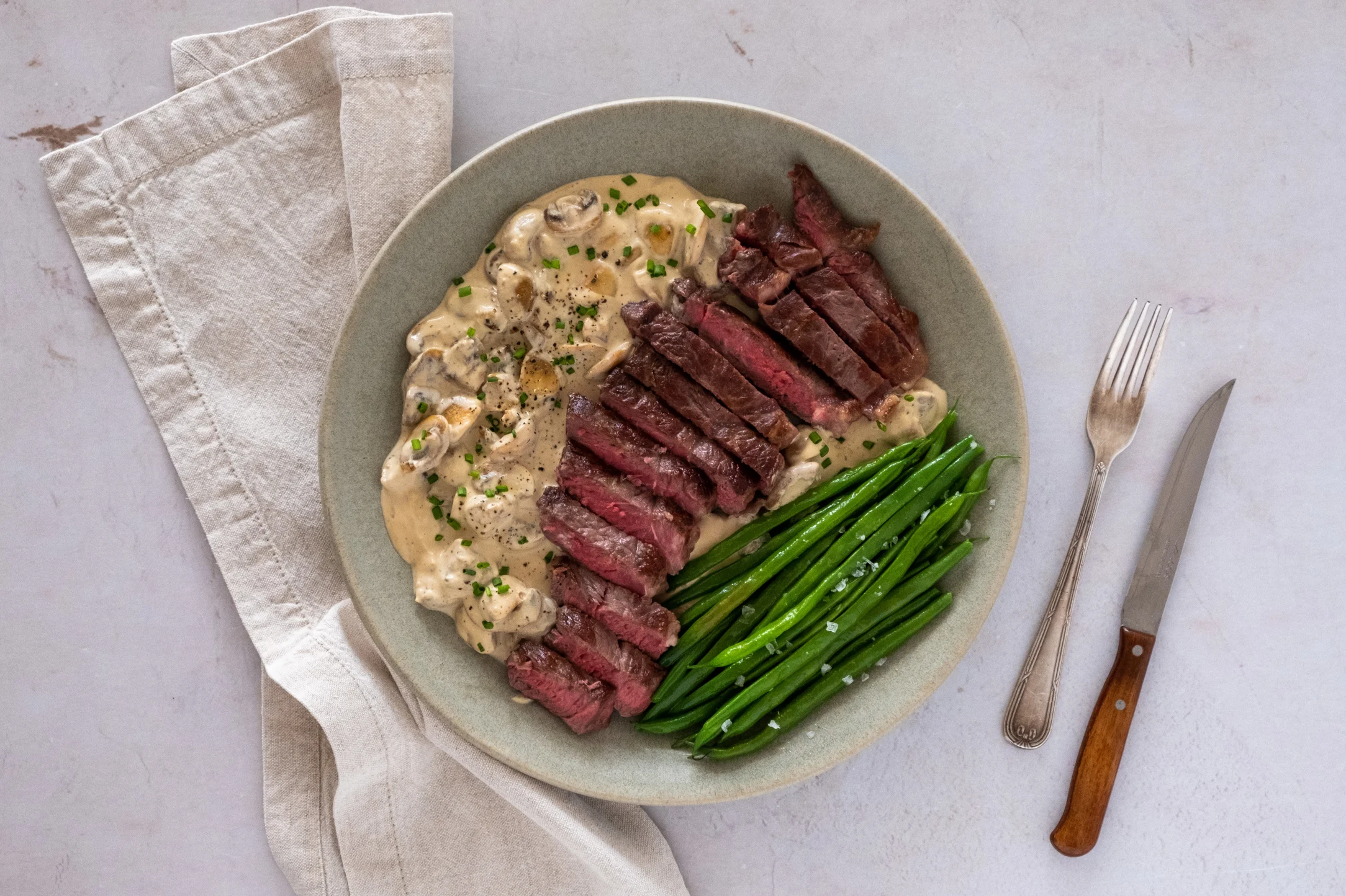 Rib-Eye Steak with Creamy Mushroom Sauce and Green Beans