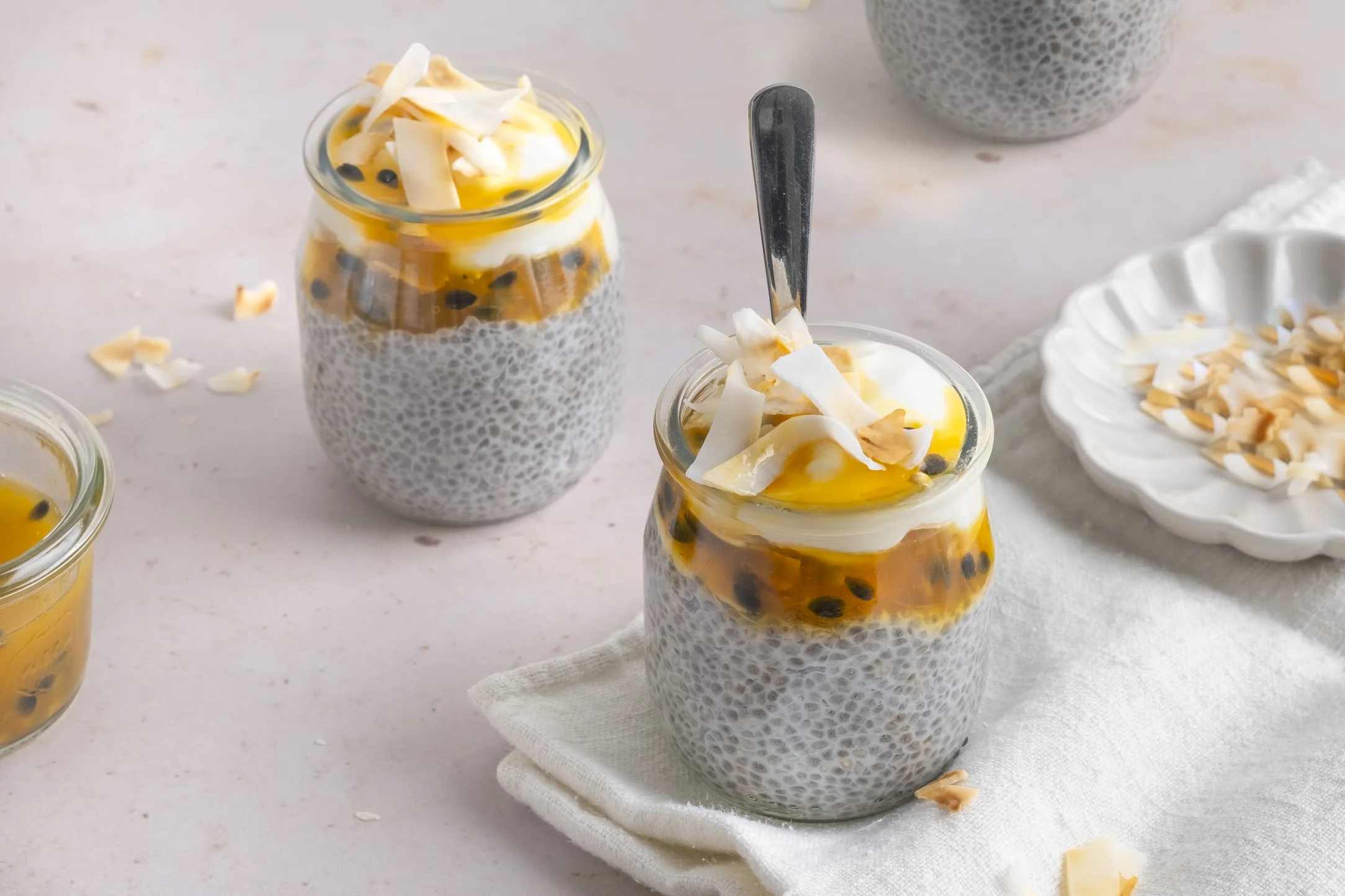 Overnight Coconut Chia Pudding with Passionfruit and Toasted Coconut Flakes
