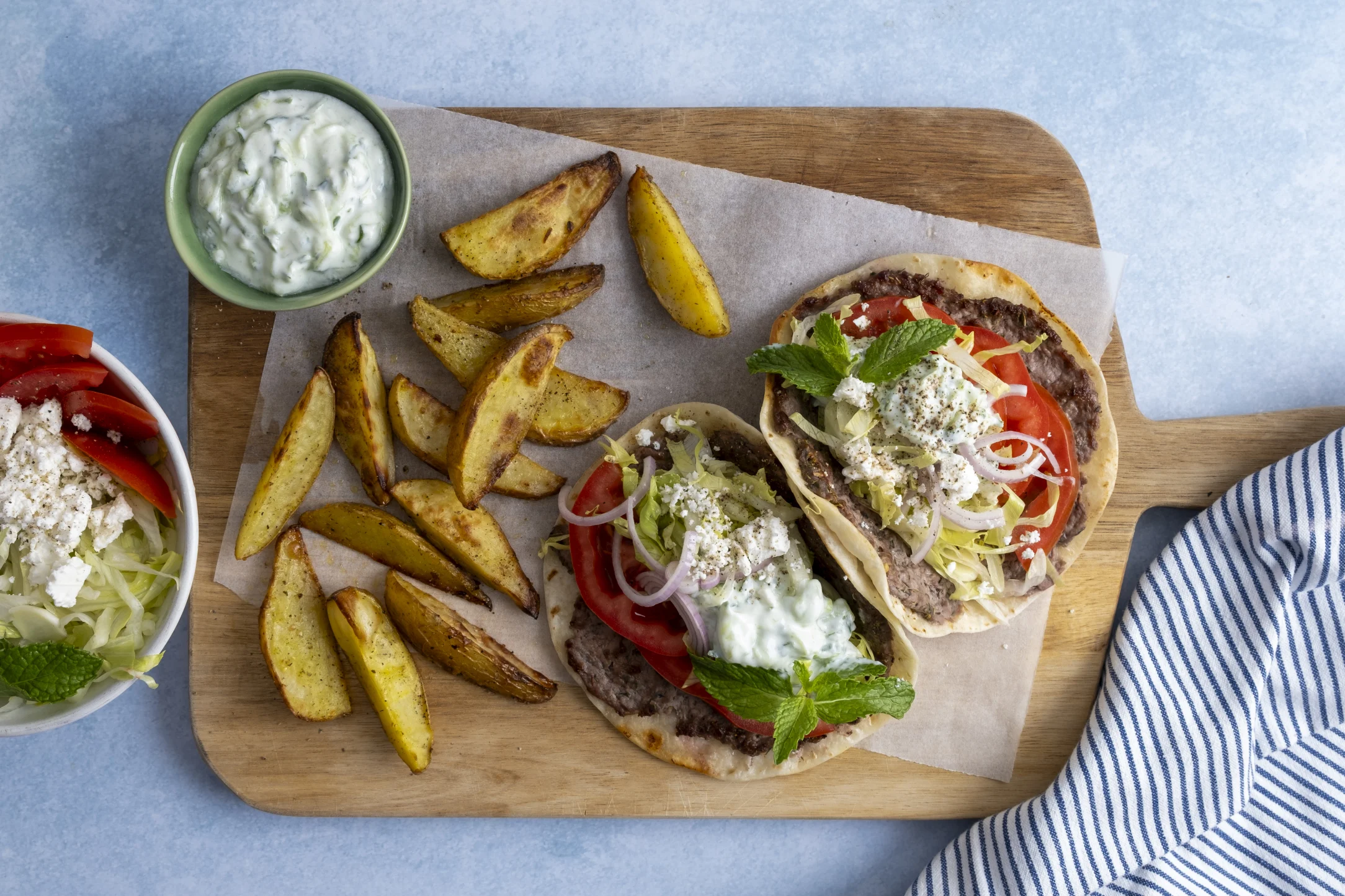 Smash Greek Lamb and Feta Tacos with Potato Wedges and Tzatziki Sauce