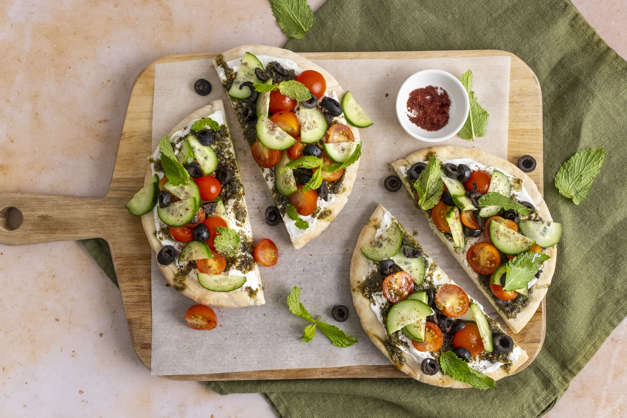 Labneh and Zaatar Manakeesh with Cucumbers, Tomatoes, Olives and Mint