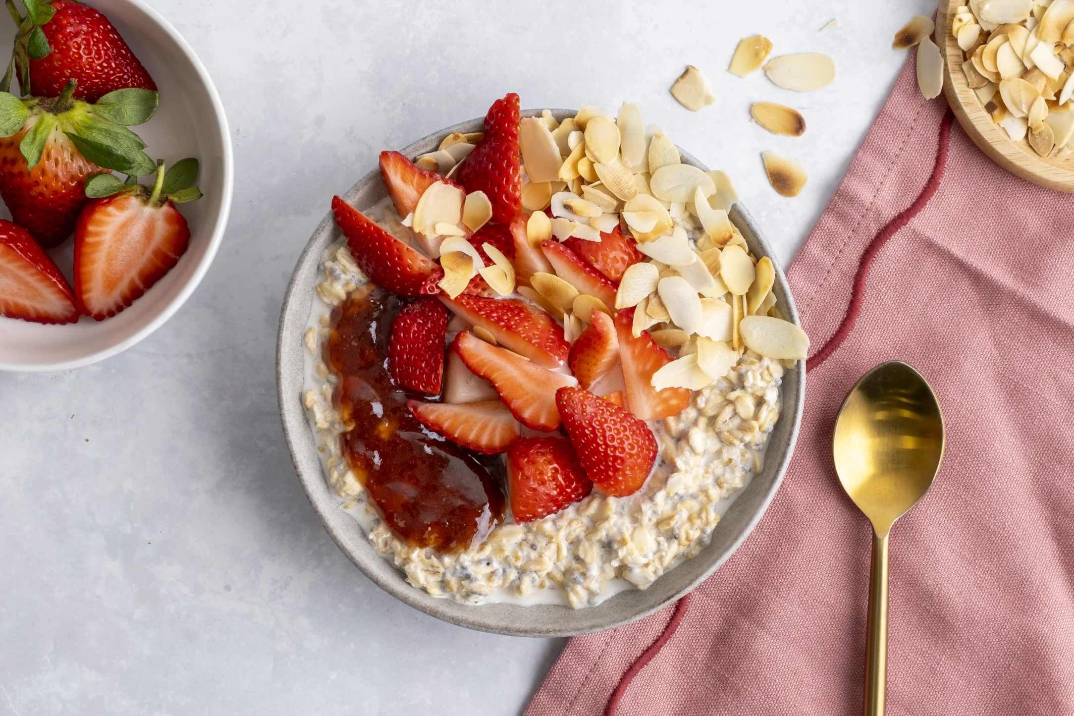 Overnight Oats with Fresh Strawberries, Strawberry Jam and Almond Flakes