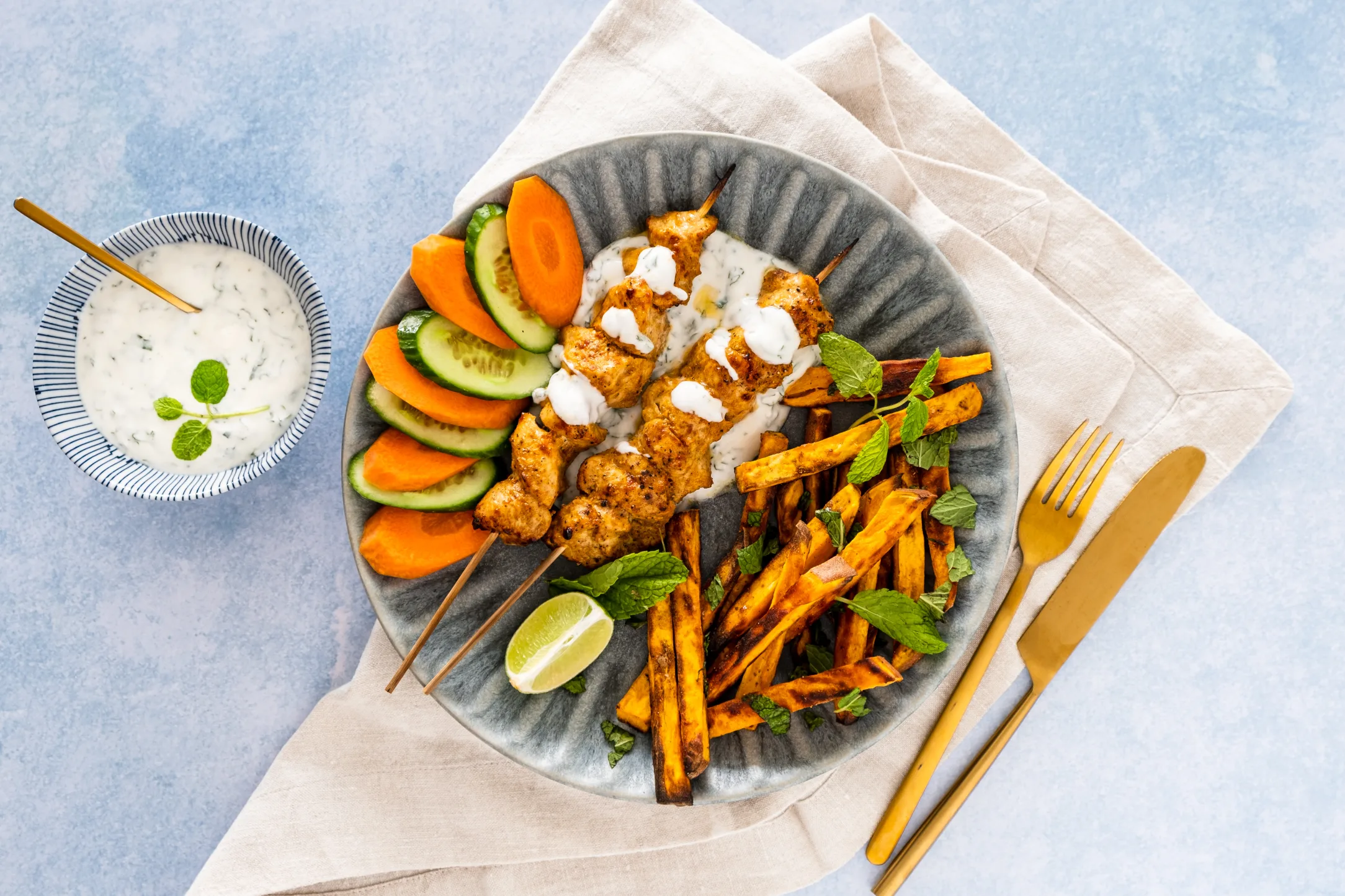 Curried Chicken Skewers and Masala Fries with Mint Yogurt and Fresh Vegetables
