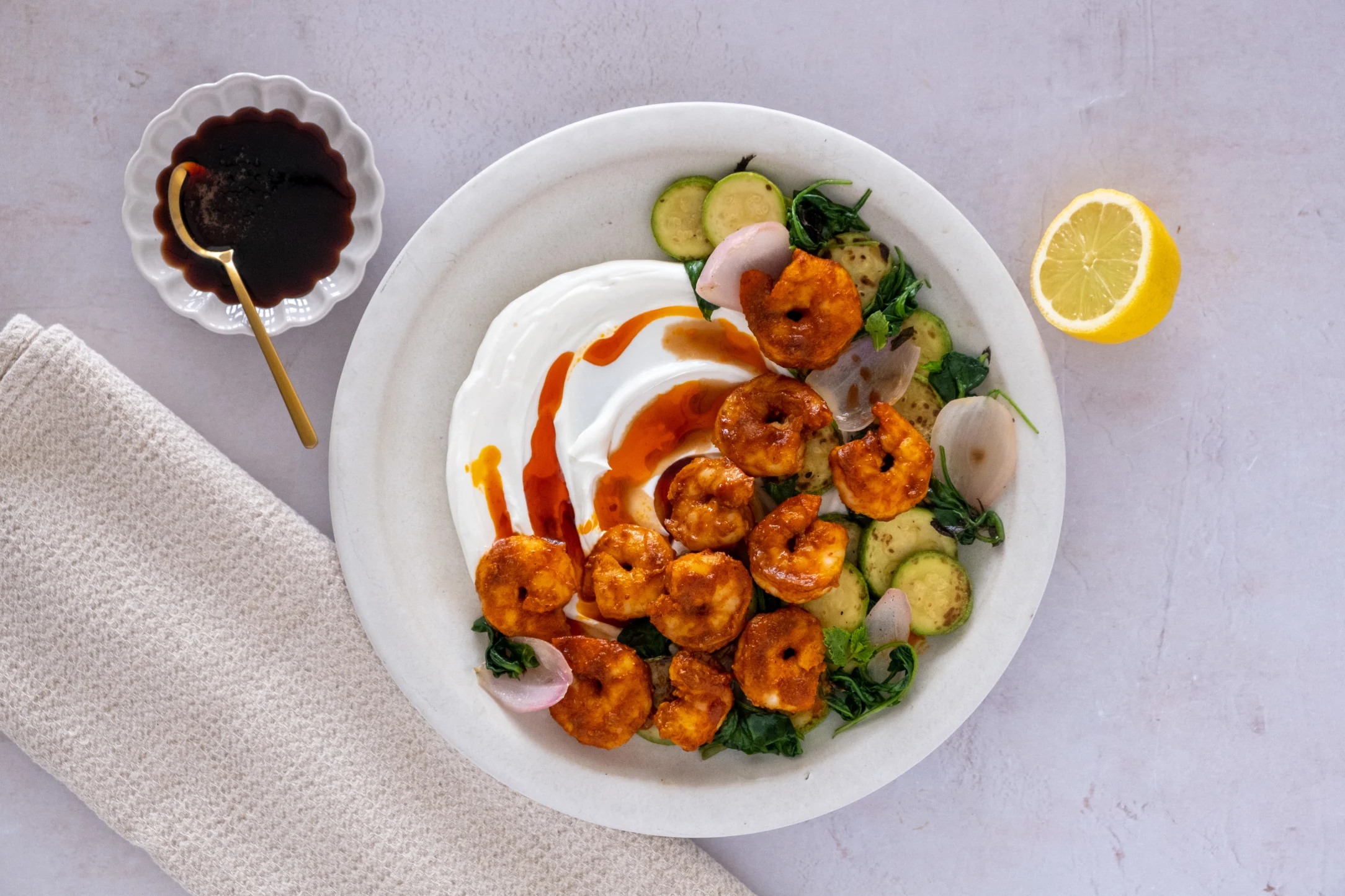 Prawns in Harissa Butter with Lemon Mint Zucchini and Labneh