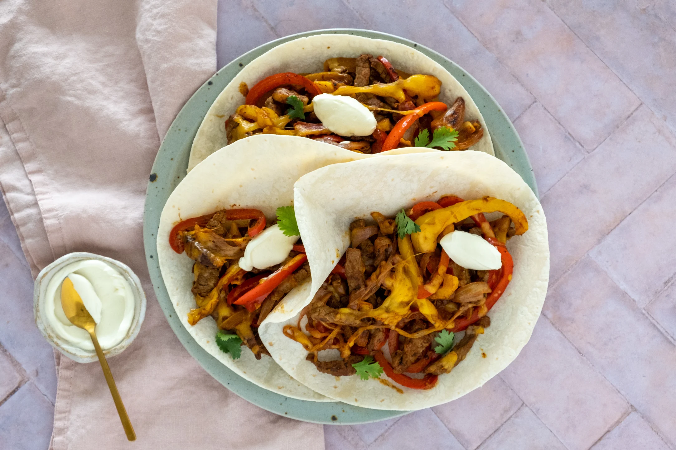 Cheesy Steak Fajitas with Peppers and Sour Cream