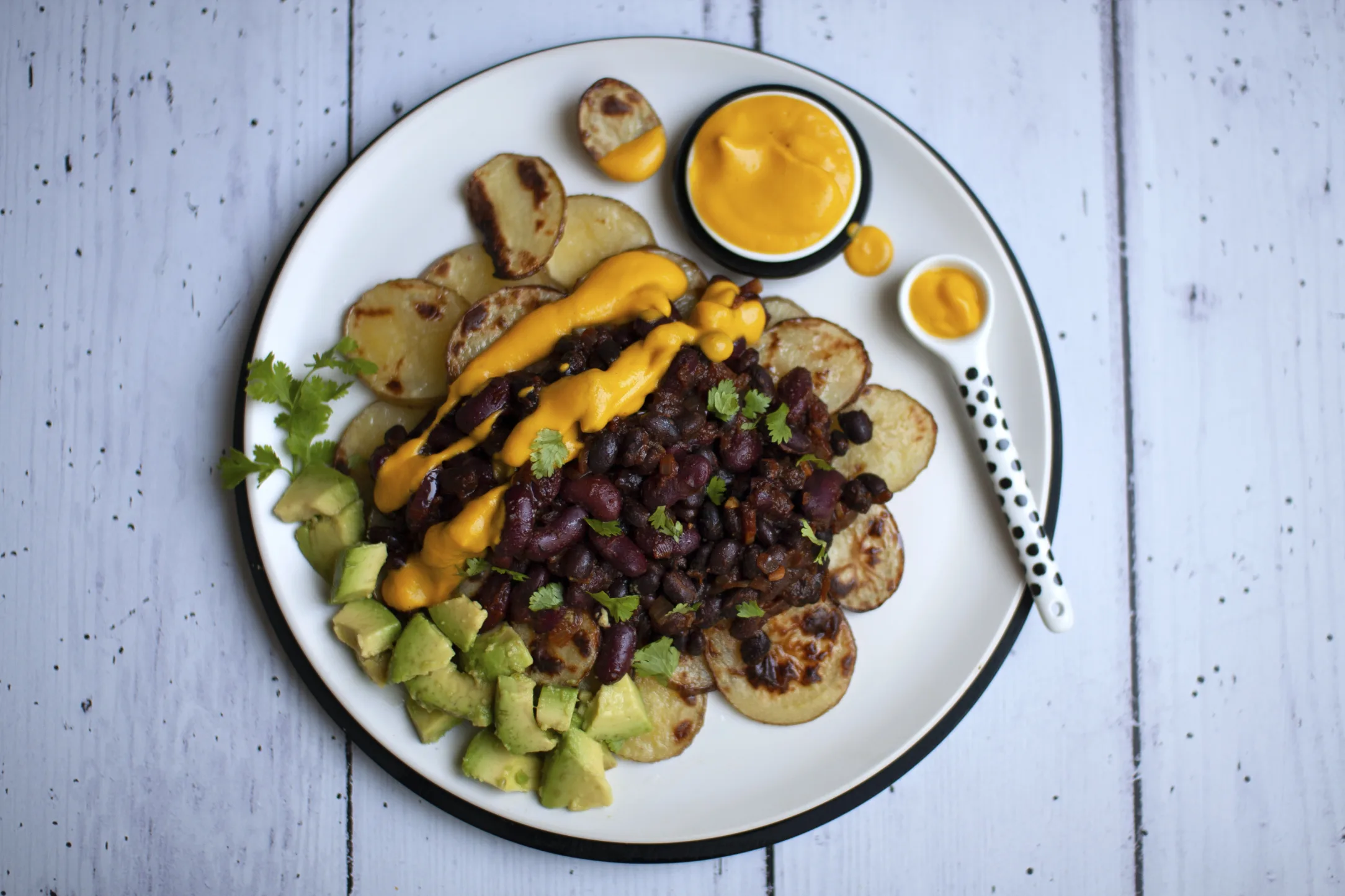 Potato Nachos with Taco Beans, Vegan Queso and Avocado