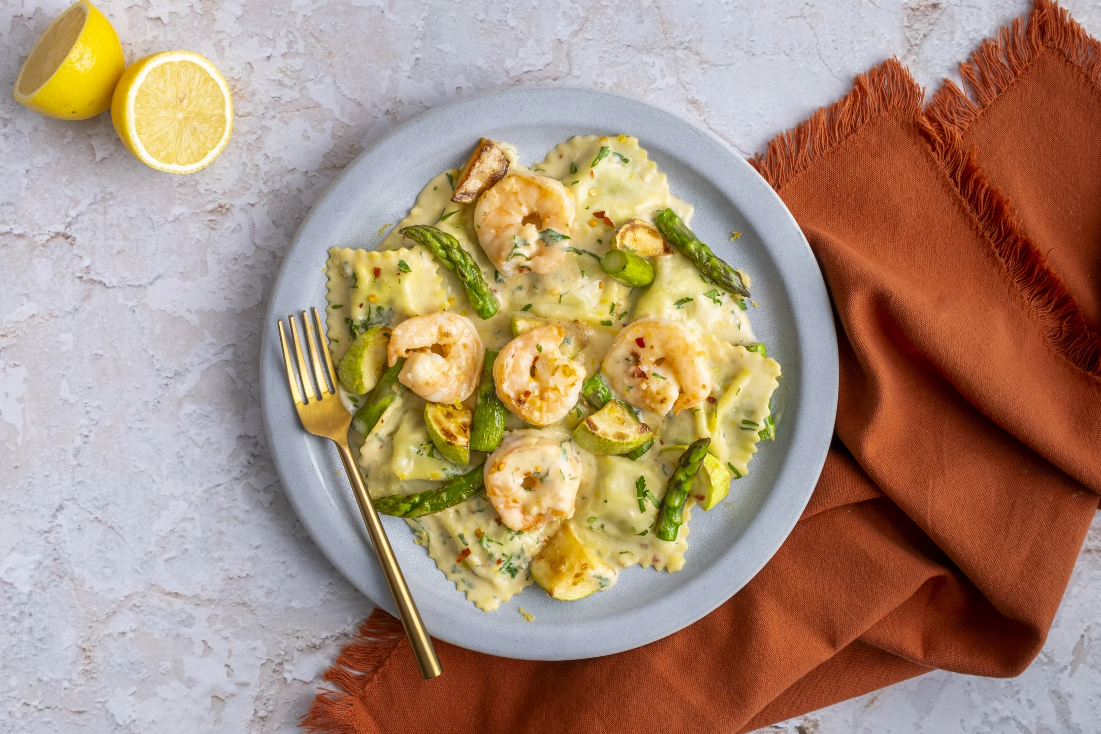 Jumbo Garlic Prawns and Ricotta Spinach Ravioli with Charred Veg in a Creamy Lemon Sauce