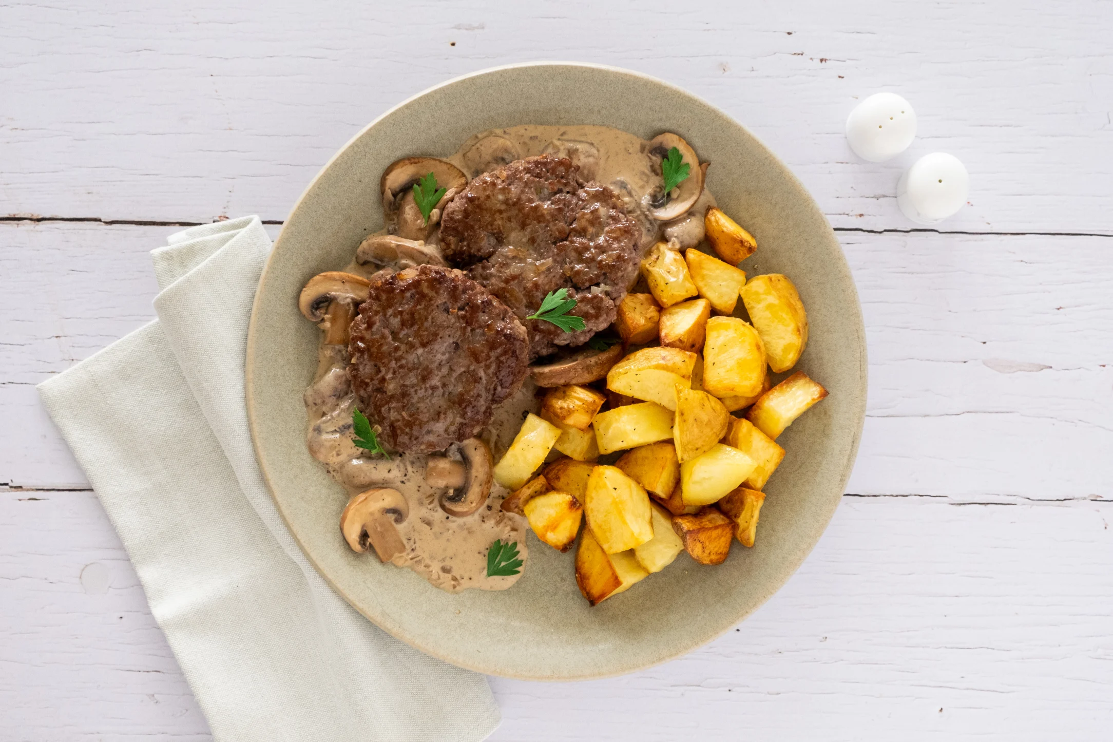 Beef Patties in a Creamy Mushroom Sauce with Roasted Potatoes