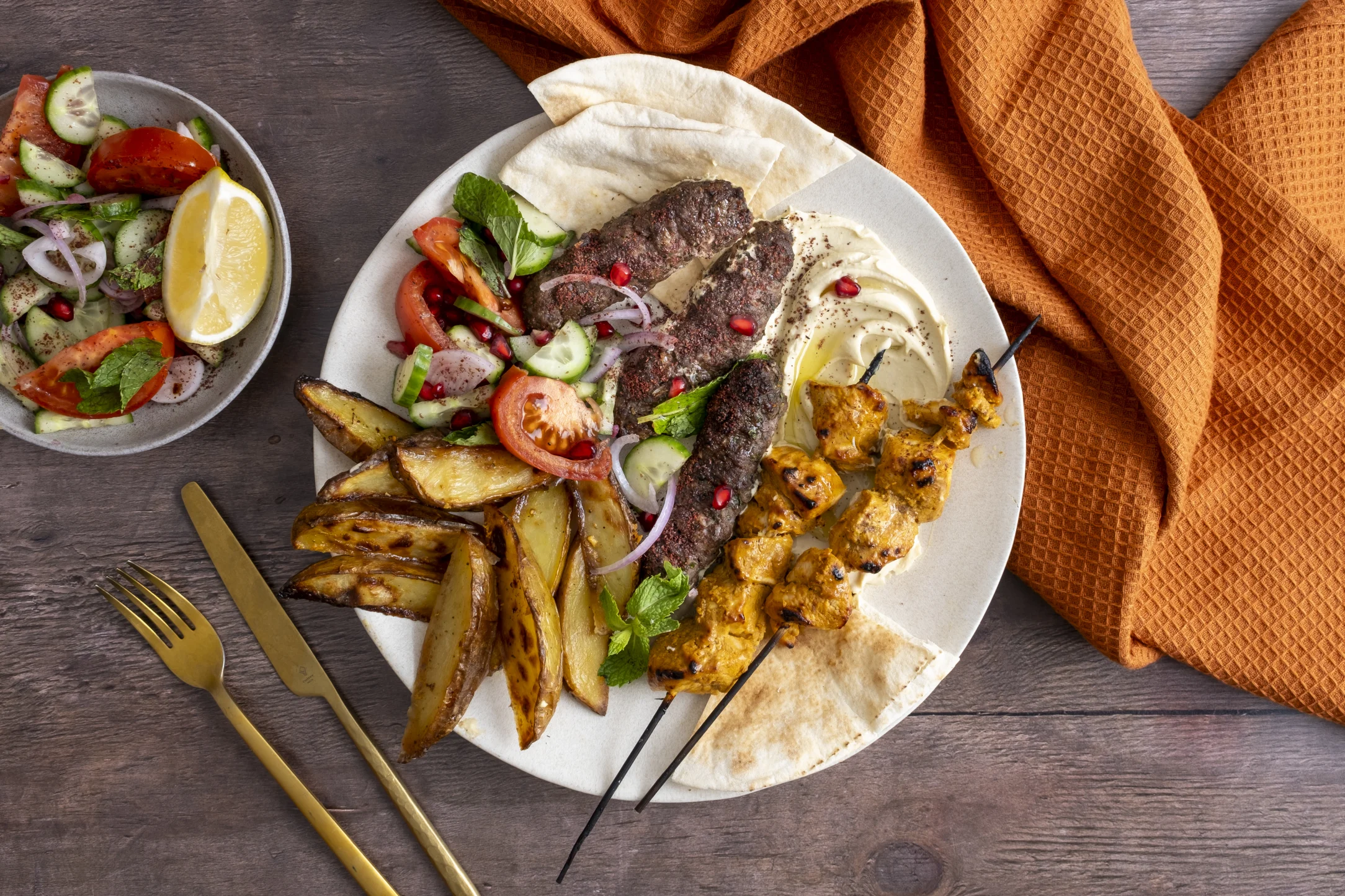 Mixed Grill Platter: Chicken Shish Tawook and Lamb Kebabs with Roast Potatoes, Hummus and Salad