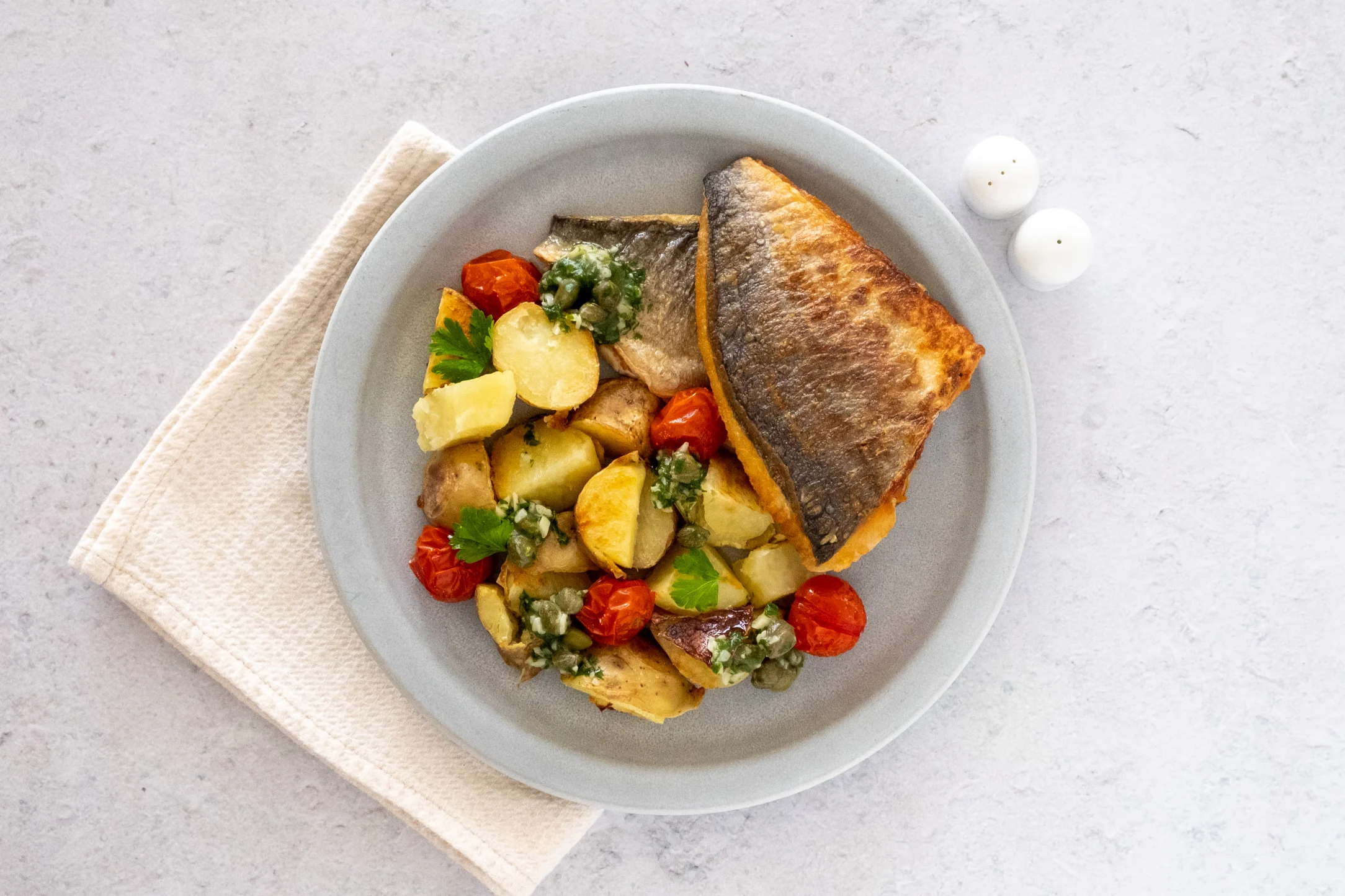Seabream, Garlic Butter and Crushed Potatoes with Roasted Cherry Tomatoes