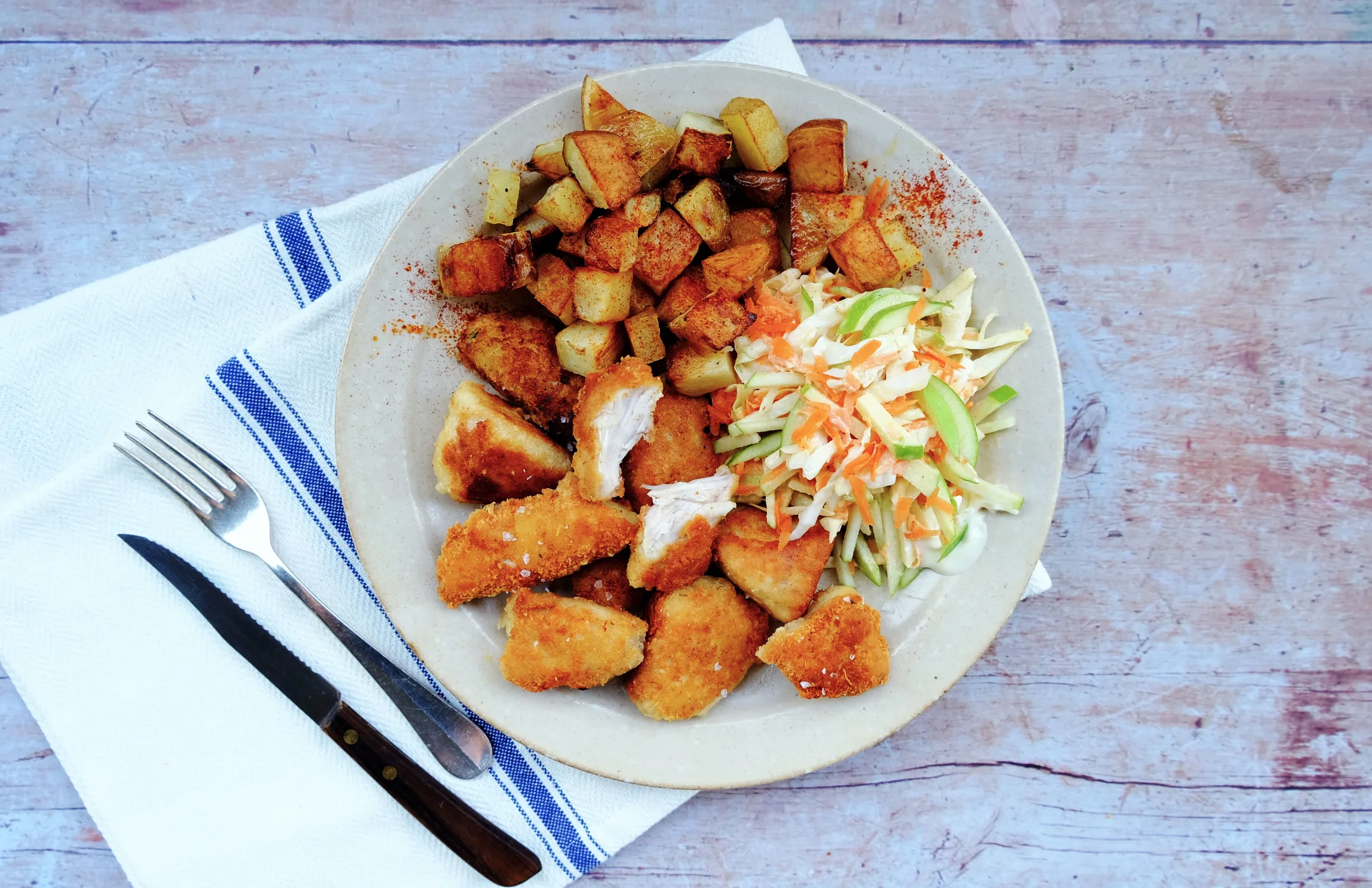 Parmesan Chicken Nuggets with Potato Cubes and Slaw