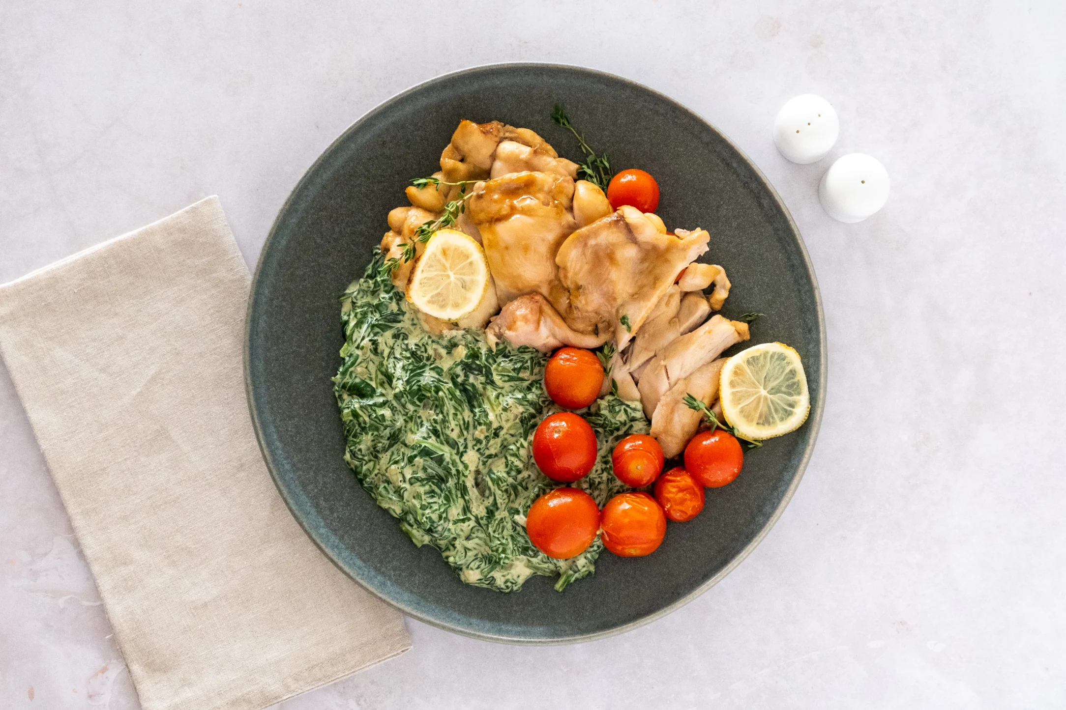 Baked Lemon Thyme Chicken with Tomatoes and Creamed Spinach