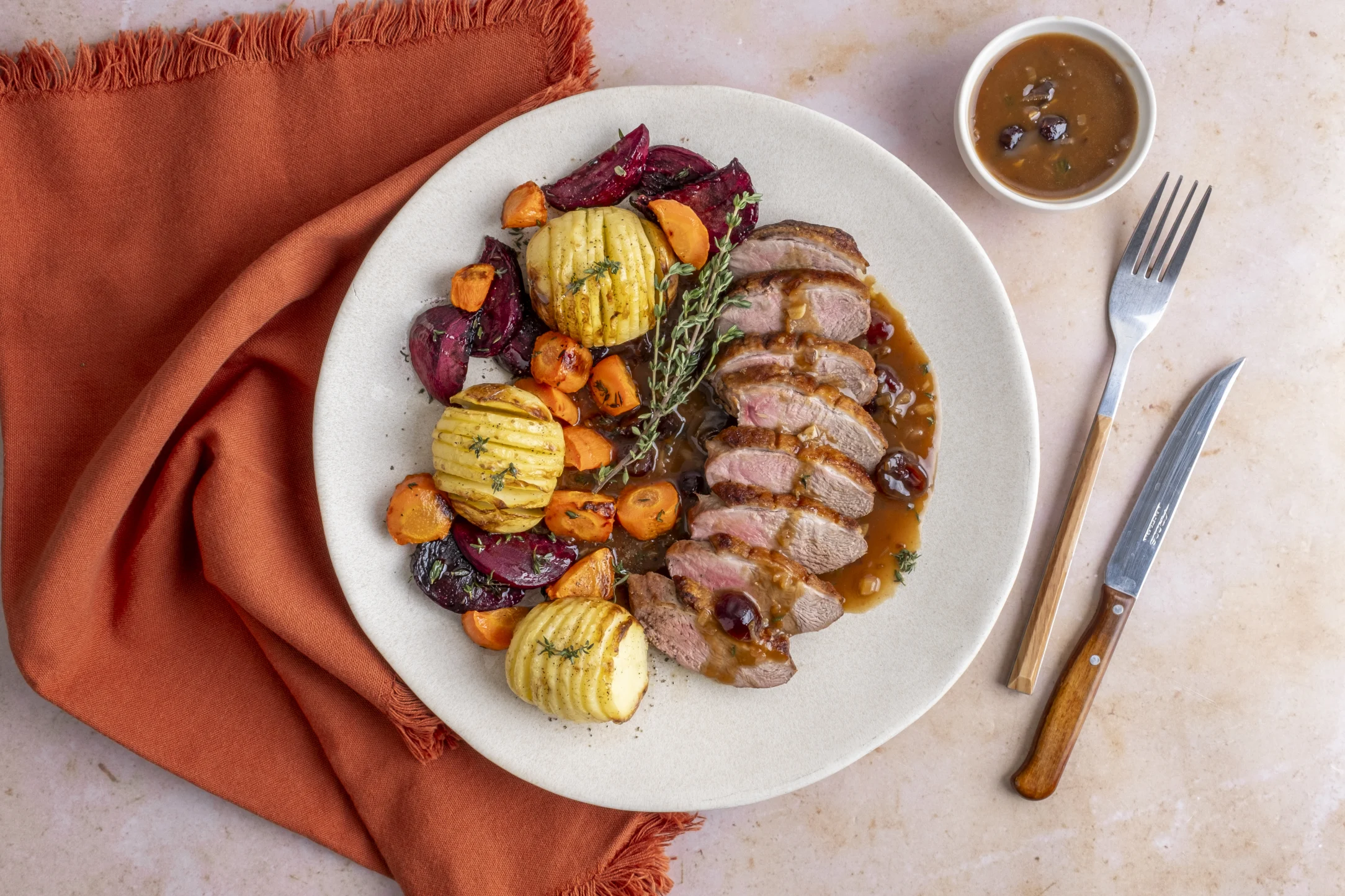 Duck Breasts in a Cranberry Sauce with Roasted Beetroot and Hasselback Potatoes